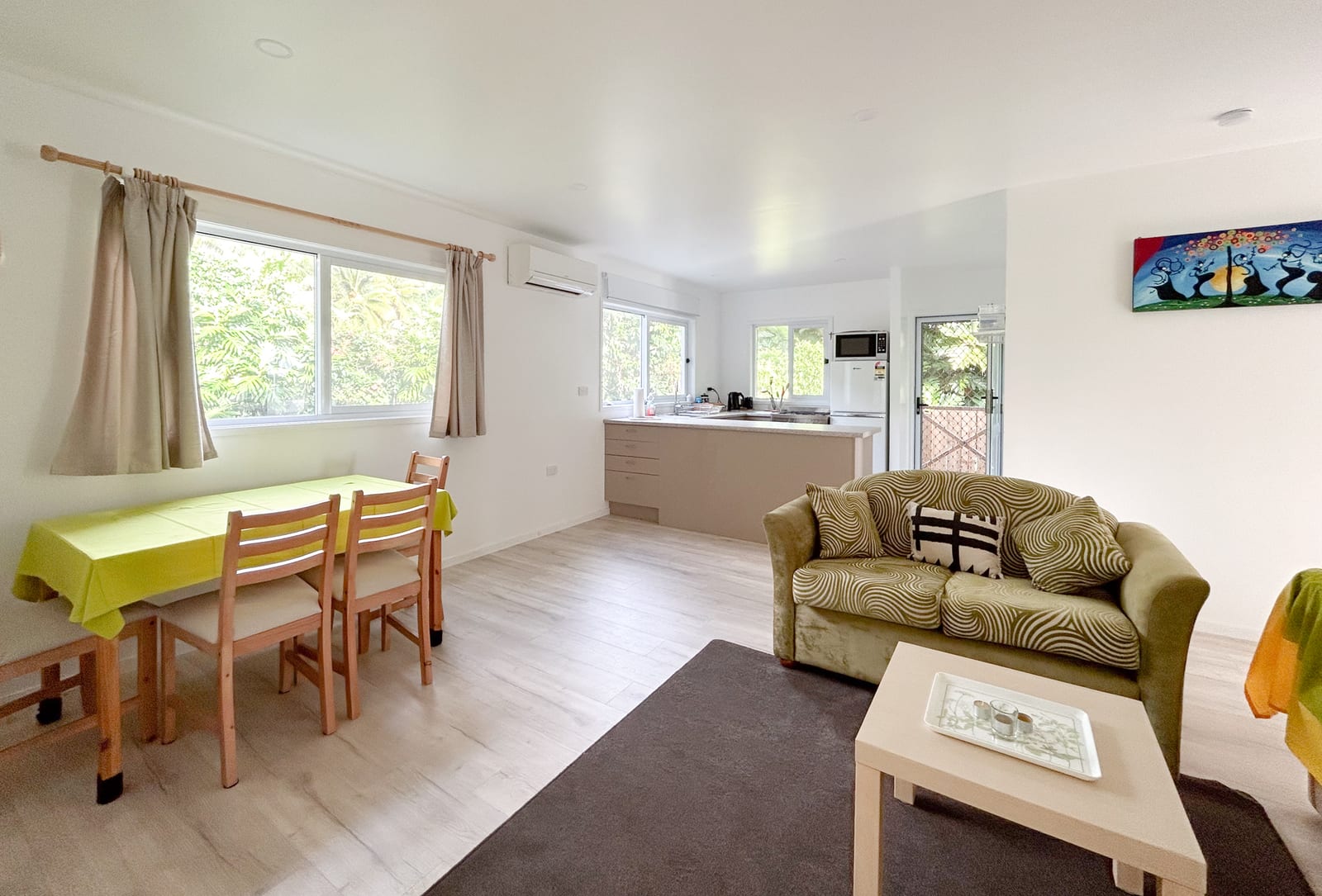 Light-filled lounge and living area, furnished rental home Inave
